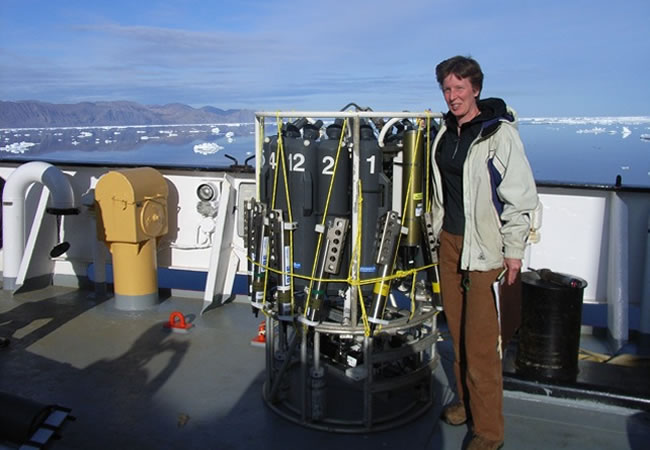 Dr Berit Rabe on board Canadian Coast Guard Ship Henry Larsen in Nares Strait, next to her favourite instruments that can measure temperature, conductivity, pressure, and take water samples.