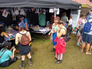 ScienceGrrl festival stand surrounded by people of all ages