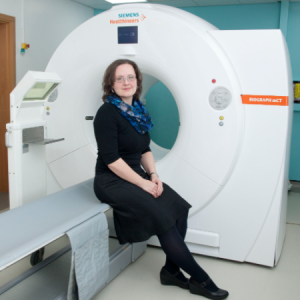 Heather Williams with a positron tomography scanner